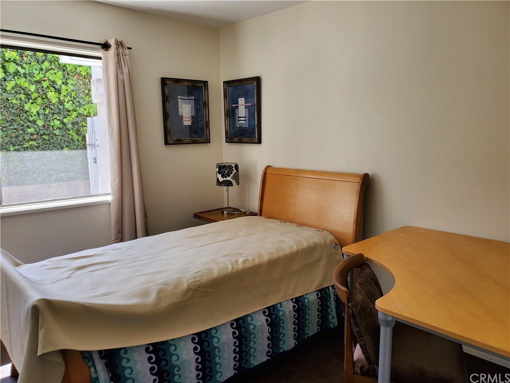 5001 Paseo Dali Irvine, CA 92603 - Photo 18 of 20 a bedroom with a bed and a window