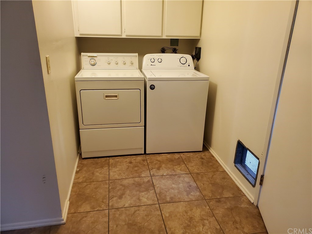 5001 Paseo Dali Irvine, CA 92603 - Photo 20 of 20 a utility room with dryer and washer
