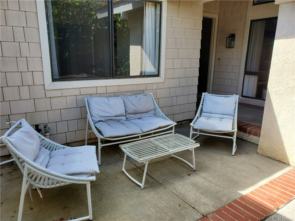 5001 Paseo Dali Irvine, CA 92603 - Photo 2 of 20 a couple of chairs sitting in front of a door