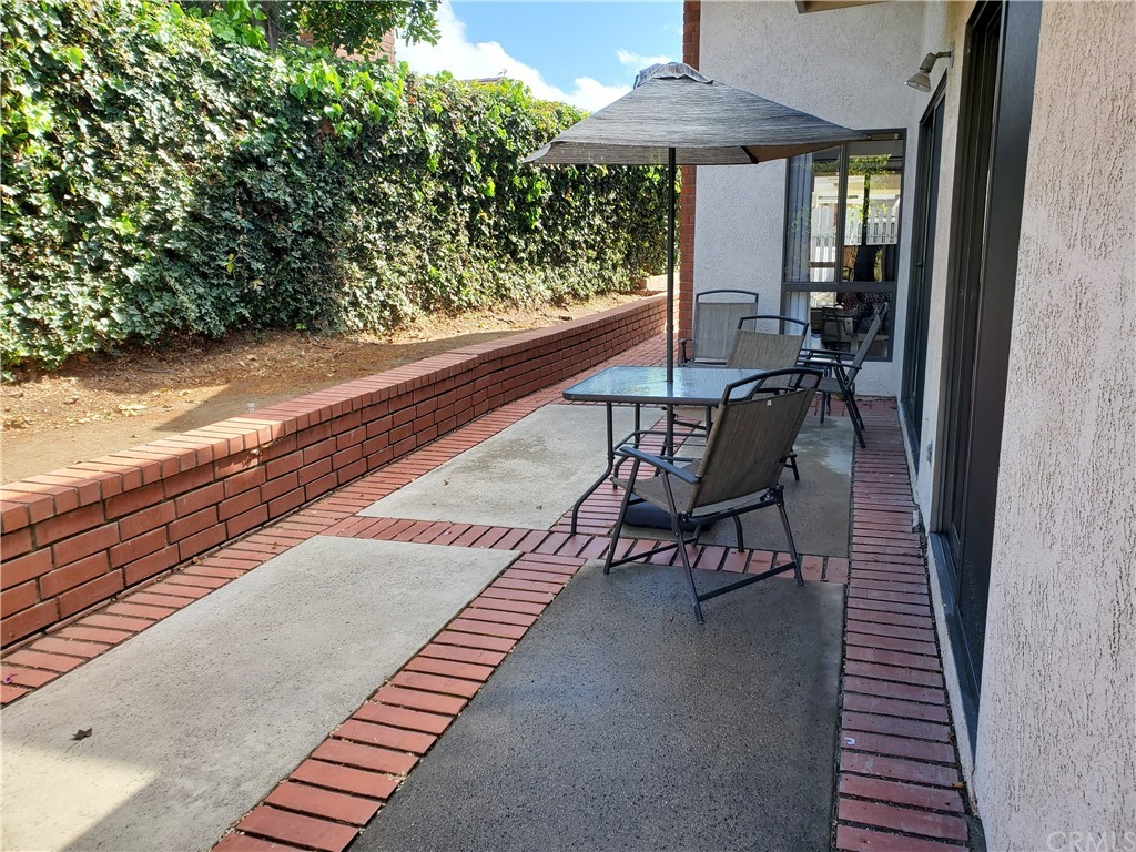 5001 Paseo Dali Irvine, CA 92603 - Photo 4 of 20 a view of a patio with two chairs and a table