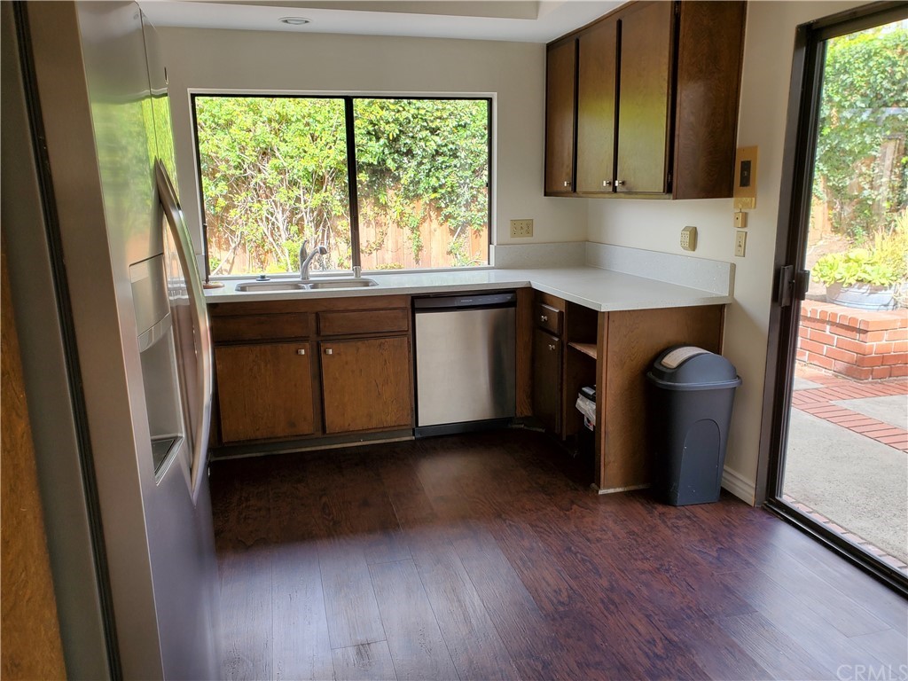 5001 Paseo Dali Irvine, CA 92603 - Photo 10 of 20 a kitchen with a sink a counter top space and cabinets