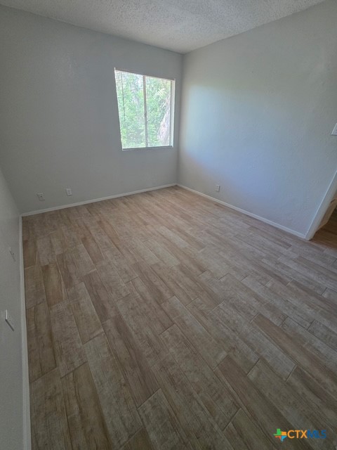 2010 South 15th Street, Unit B Temple, TX 76504 - Photo 10 of 12 an empty room with a window