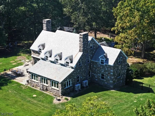 a view of a house with a yard porch and sitting area