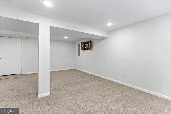 an empty room with a ceiling fan
