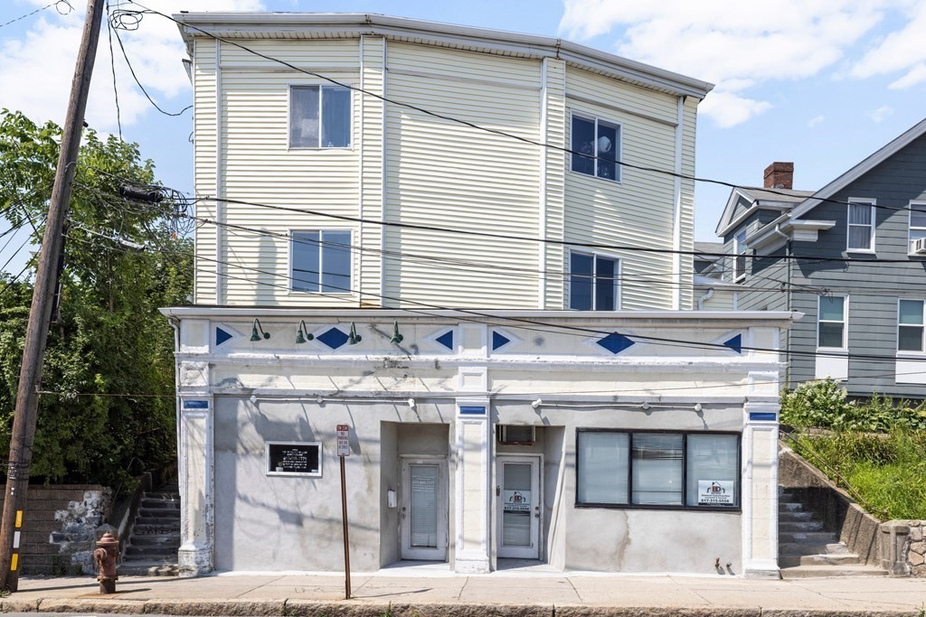 382 McGrath Highway Somerville, MA 02143 - Photo 1 of 31 a front view of a building with entryway