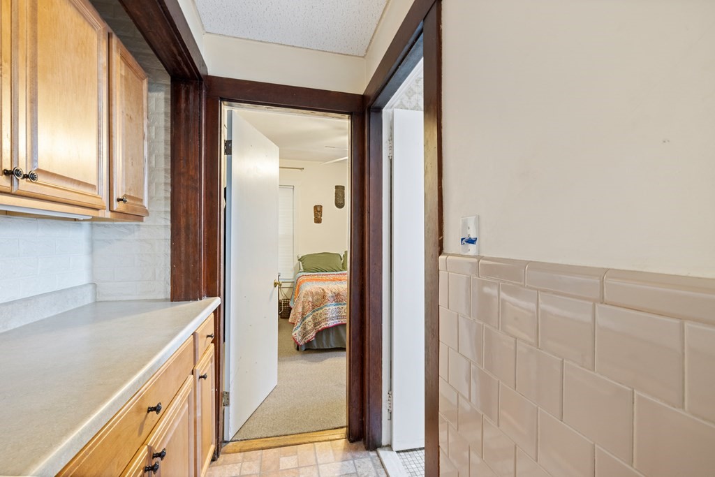 382 McGrath Highway Somerville, MA 02143 - Photo 11 of 31 a view of a kitchen from the hallway