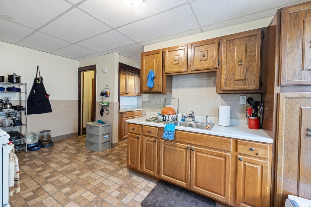 382 McGrath Highway Somerville, MA 02143 - Photo 12 of 31 a kitchen with granite countertop a sink cabinets and stainless steel appliances
