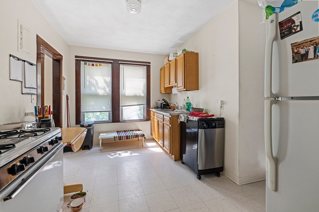 382 McGrath Highway Somerville, MA 02143 - Photo 15 of 31 a bedroom with furniture and a window