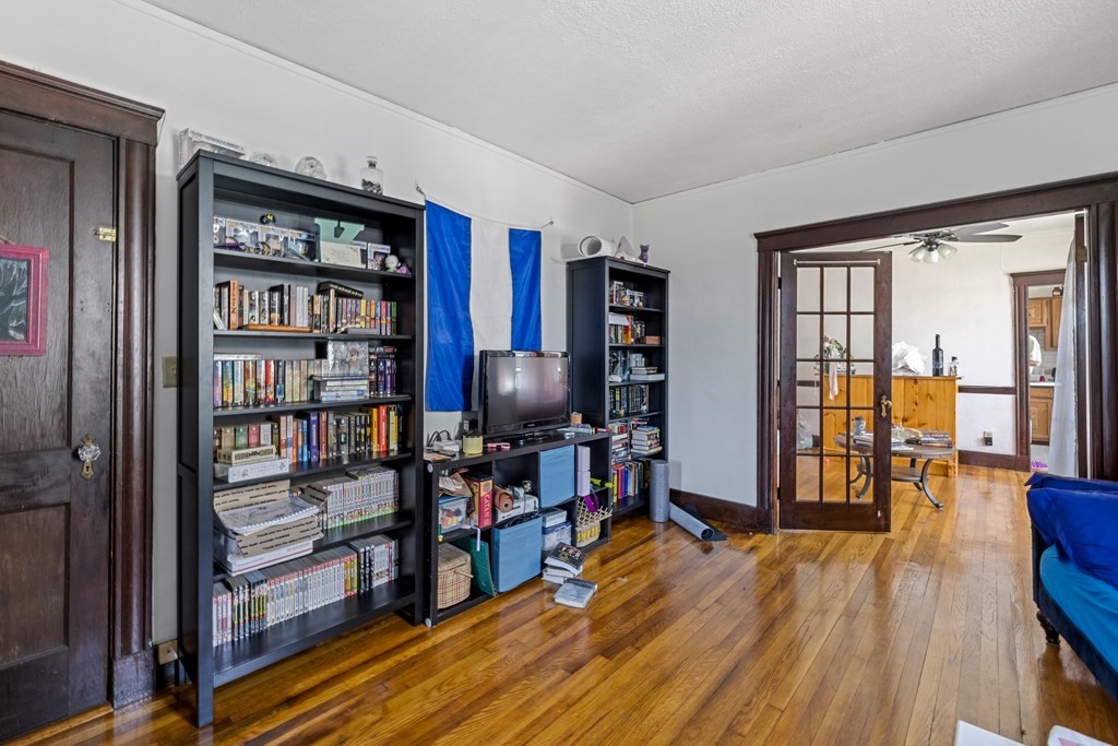 382 McGrath Highway Somerville, MA 02143 - Photo 17 of 31 a view of a livingroom with furniture and wooden floor