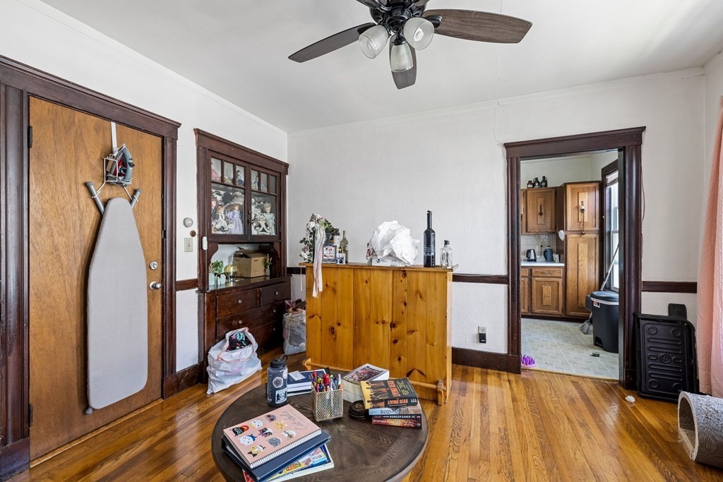382 McGrath Highway Somerville, MA 02143 - Photo 19 of 31 a living room with furniture and a flat screen tv