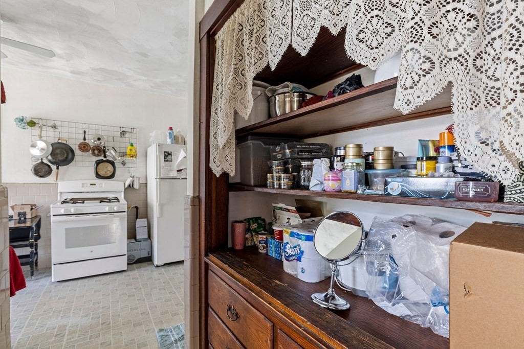 382 McGrath Highway Somerville, MA 02143 - Photo 20 of 31 a kitchen with stainless steel appliances granite countertop a stove and cabinets