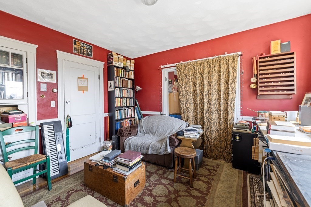 382 McGrath Highway Somerville, MA 02143 - Photo 22 of 31 a living room with furniture and a window