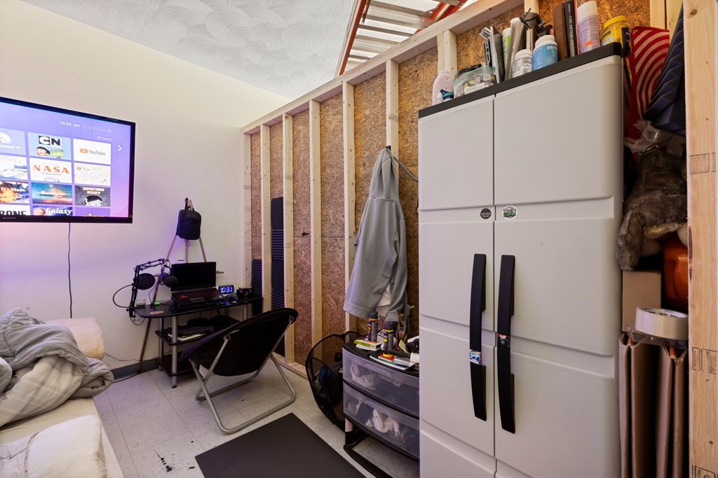 382 McGrath Highway Somerville, MA 02143 - Photo 28 of 31 a view of a workspace with furniture and a window