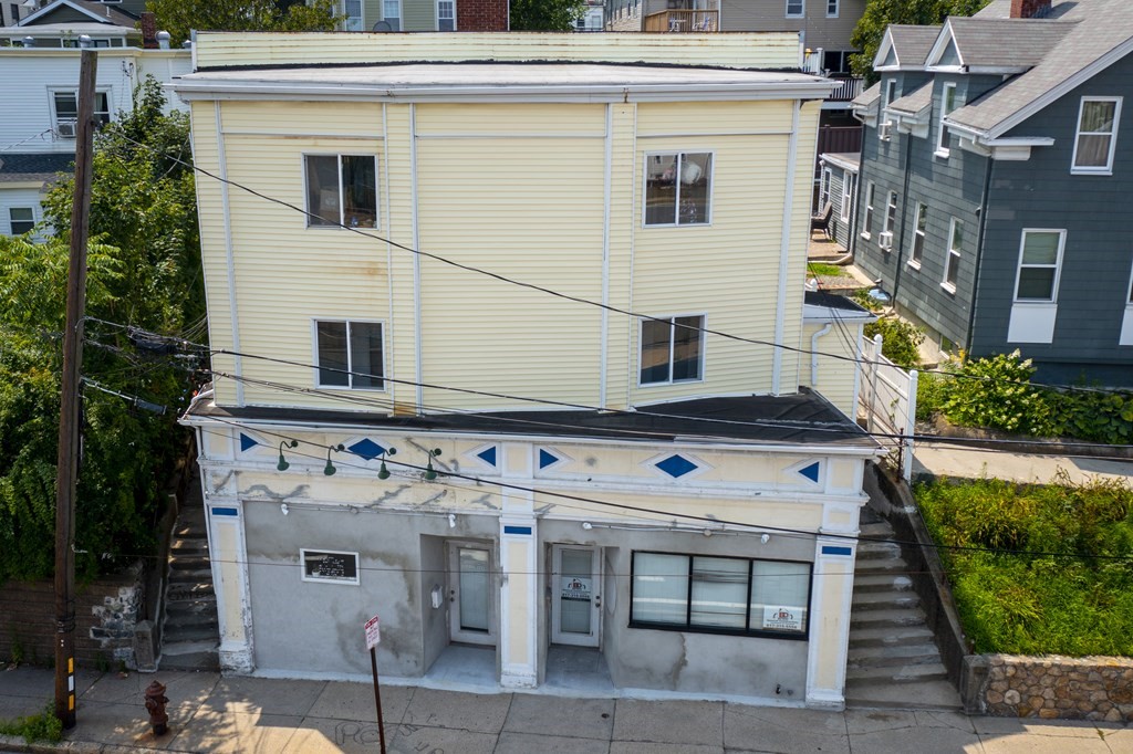 382 McGrath Highway Somerville, MA 02143 - Photo 3 of 31 a front view of a house with a yard