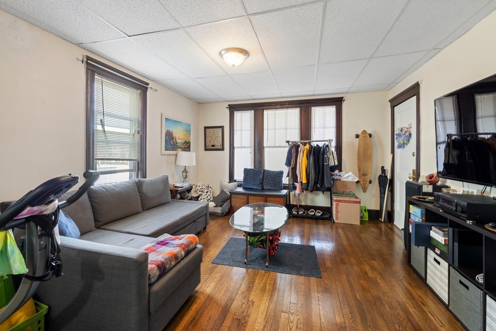 382 McGrath Highway Somerville, MA 02143 - Photo 8 of 31 a living room with furniture and a flat screen tv