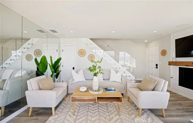 a living room with a bed furniture and a large window