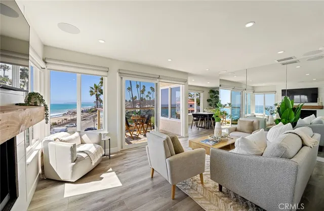 a living room with furniture fireplace and a flat screen tv