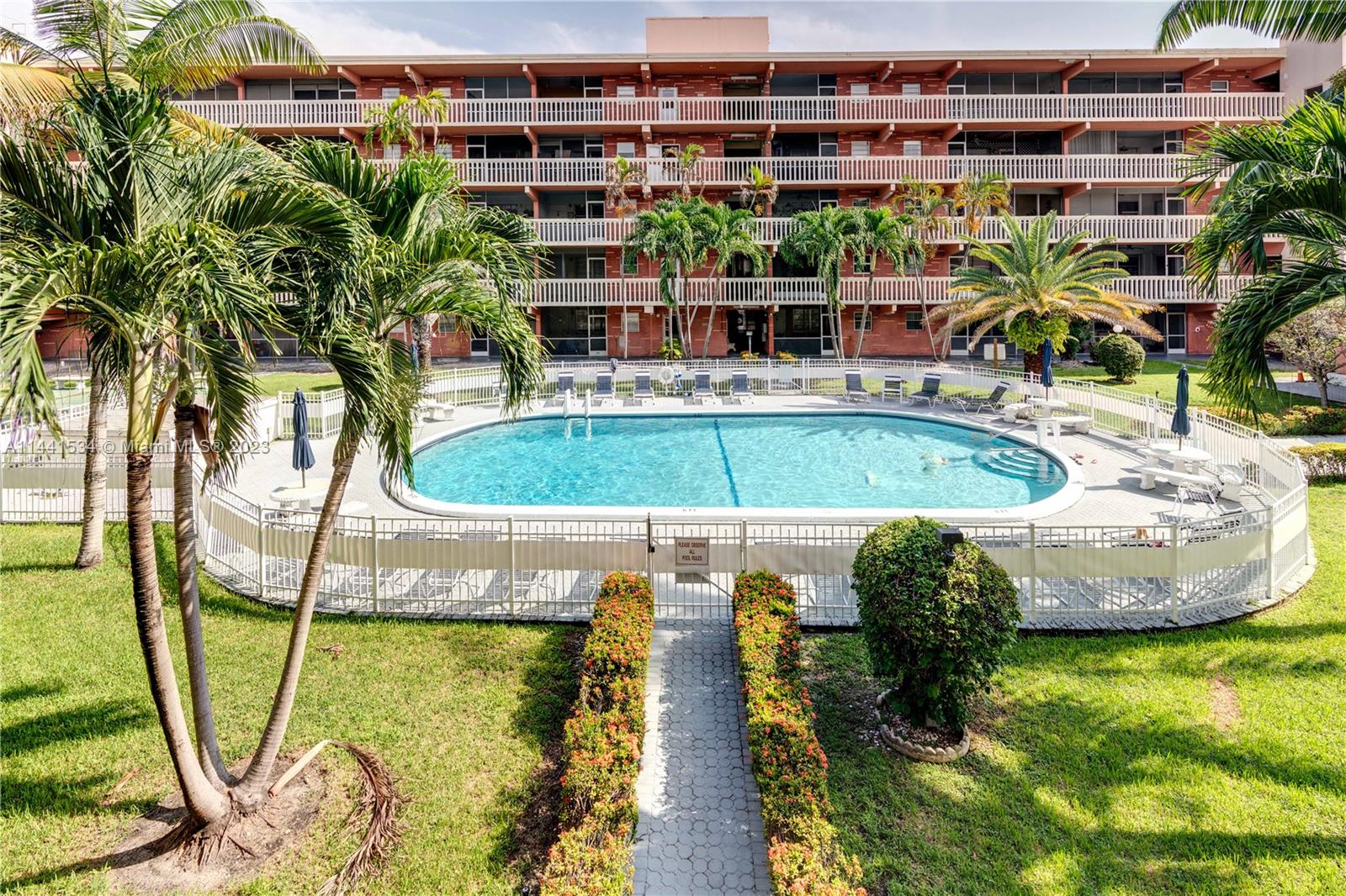 200 Northeast 12th Avenue, Unit 5B Hallandale Beach, FL 33009 - Photo 1 of 26 a view of a swimming pool