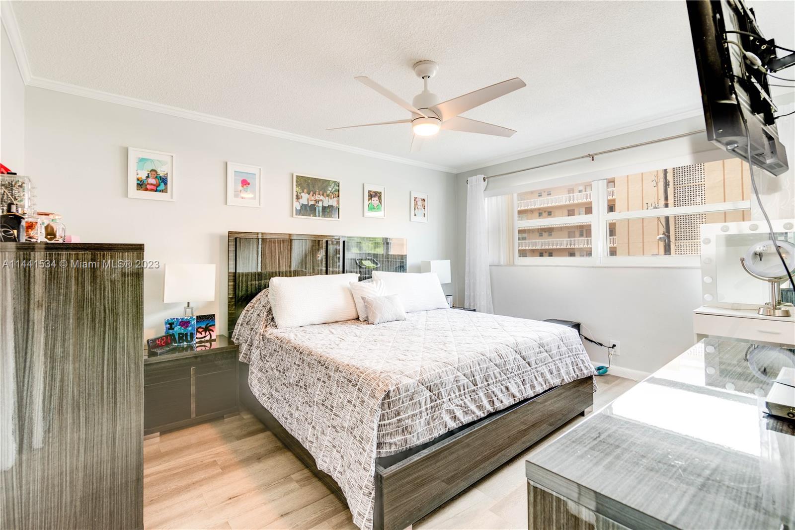 200 Northeast 12th Avenue, Unit 5B Hallandale Beach, FL 33009 - Photo 11 of 26 a bedroom with a bed and a window