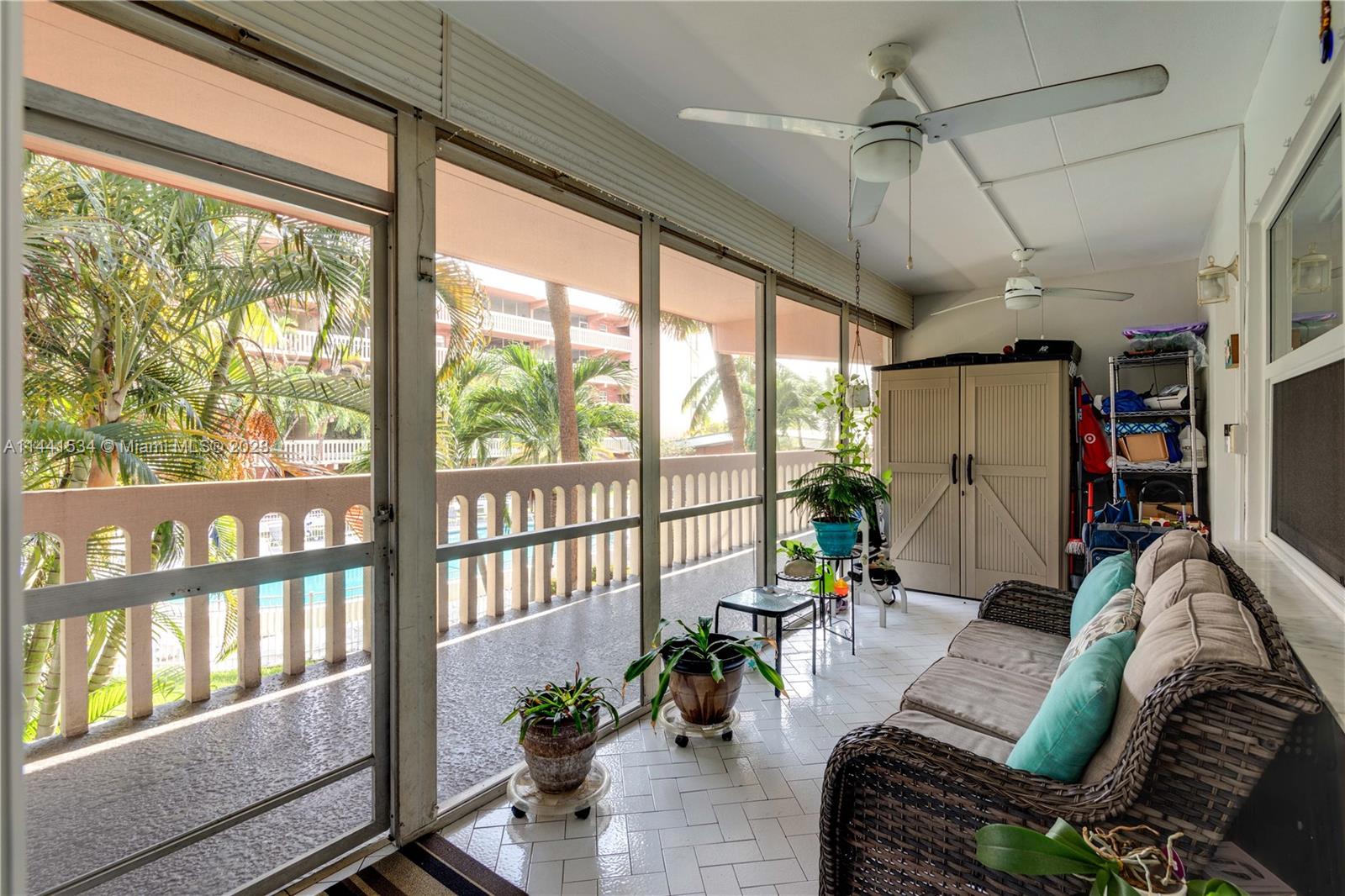 200 Northeast 12th Avenue, Unit 5B Hallandale Beach, FL 33009 - Photo 16 of 26 a living room with furniture and a floor to ceiling window
