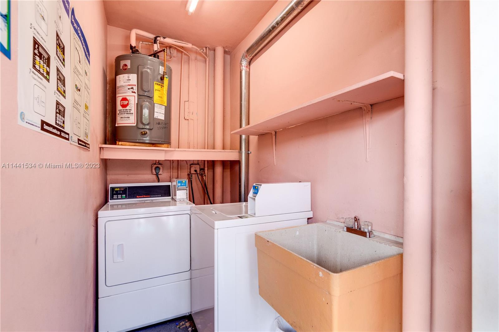 200 Northeast 12th Avenue, Unit 5B Hallandale Beach, FL 33009 - Photo 19 of 26 a utility room with dryer and washer
