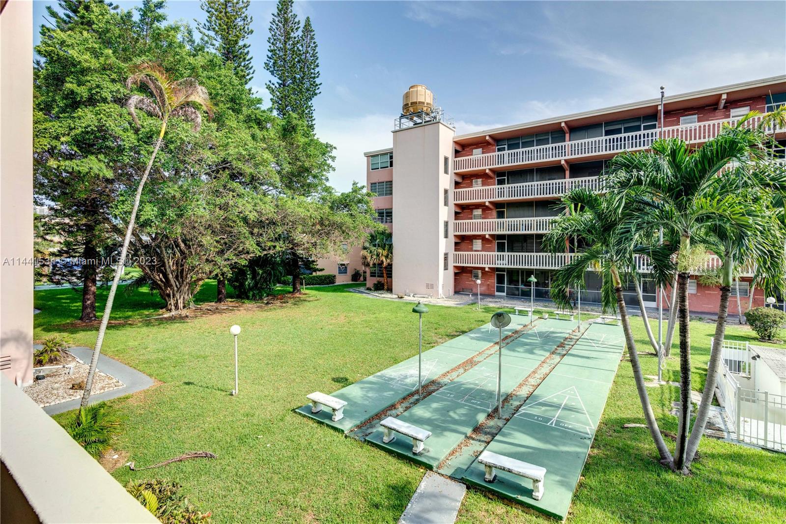 200 Northeast 12th Avenue, Unit 5B Hallandale Beach, FL 33009 - Photo 26 of 26 a view of a backyard with plants and a patio