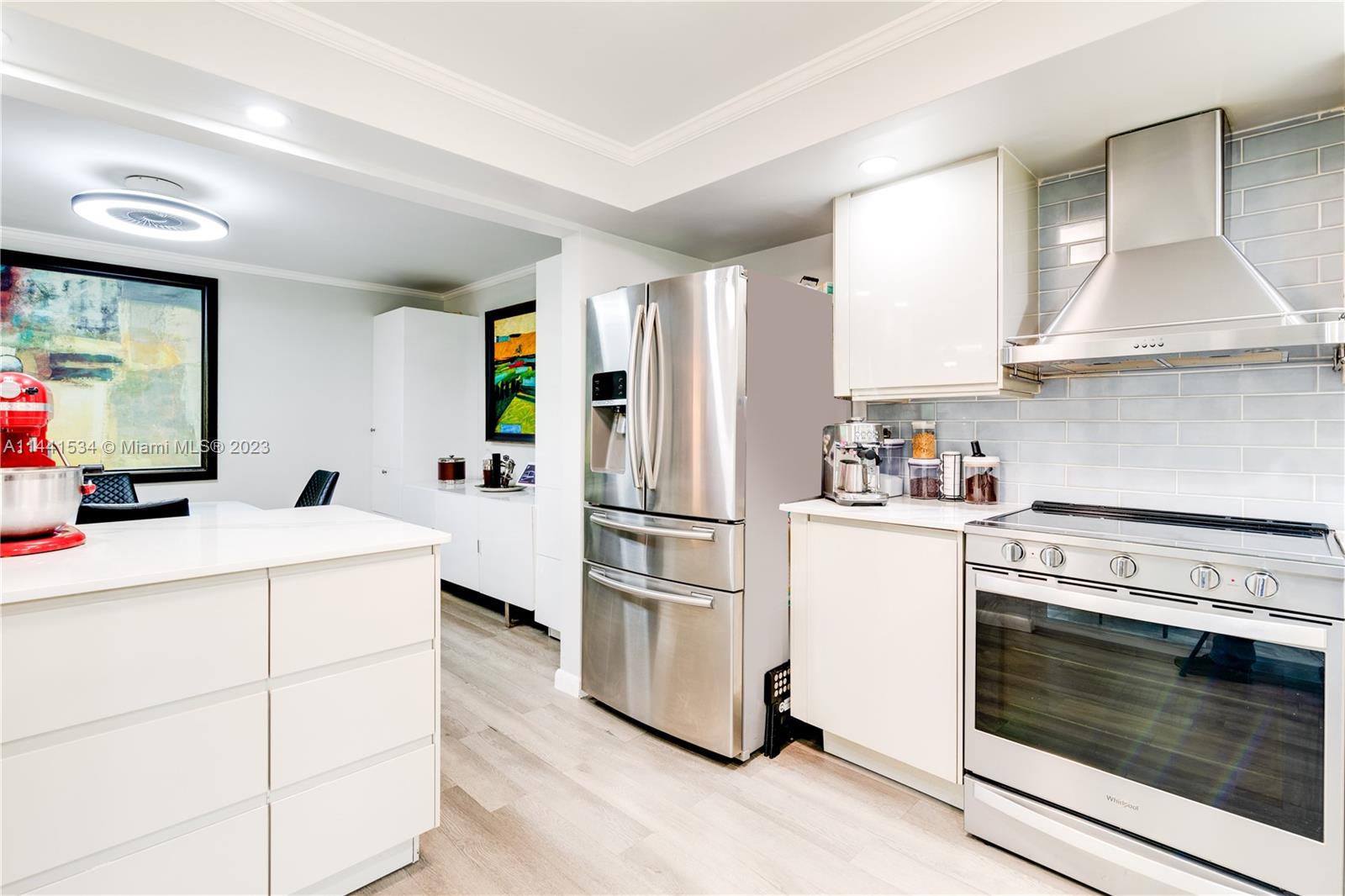 200 Northeast 12th Avenue, Unit 5B Hallandale Beach, FL 33009 - Photo 4 of 26 a kitchen with stainless steel appliances a refrigerator sink and stove