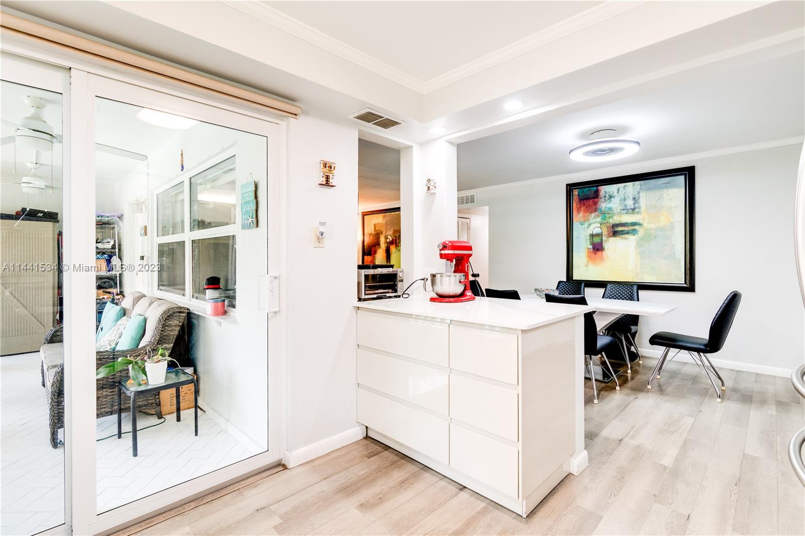 200 Northeast 12th Avenue, Unit 5B Hallandale Beach, FL 33009 - Photo 5 of 26 a work room with furniture a rug and white walls