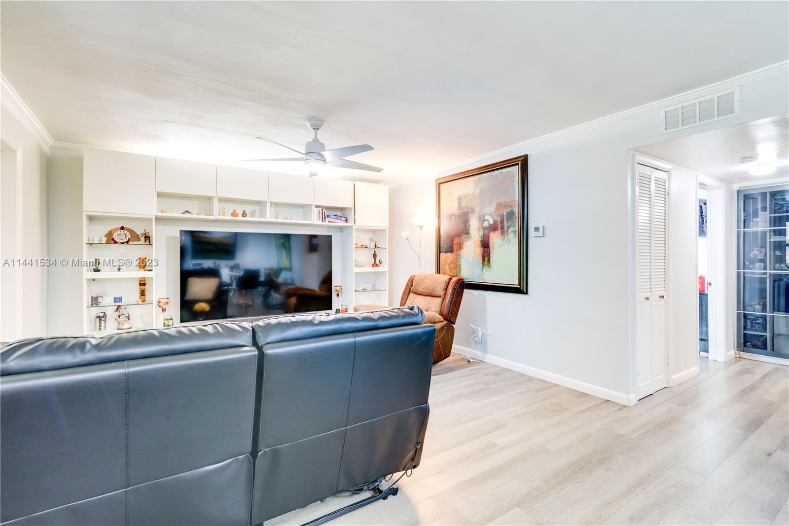 200 Northeast 12th Avenue, Unit 5B Hallandale Beach, FL 33009 - Photo 9 of 26 a living room with furniture and a fireplace