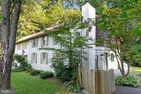 a view of a house with a yard and plants
