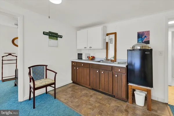 a kitchen with stainless steel appliances a sink and cabinets