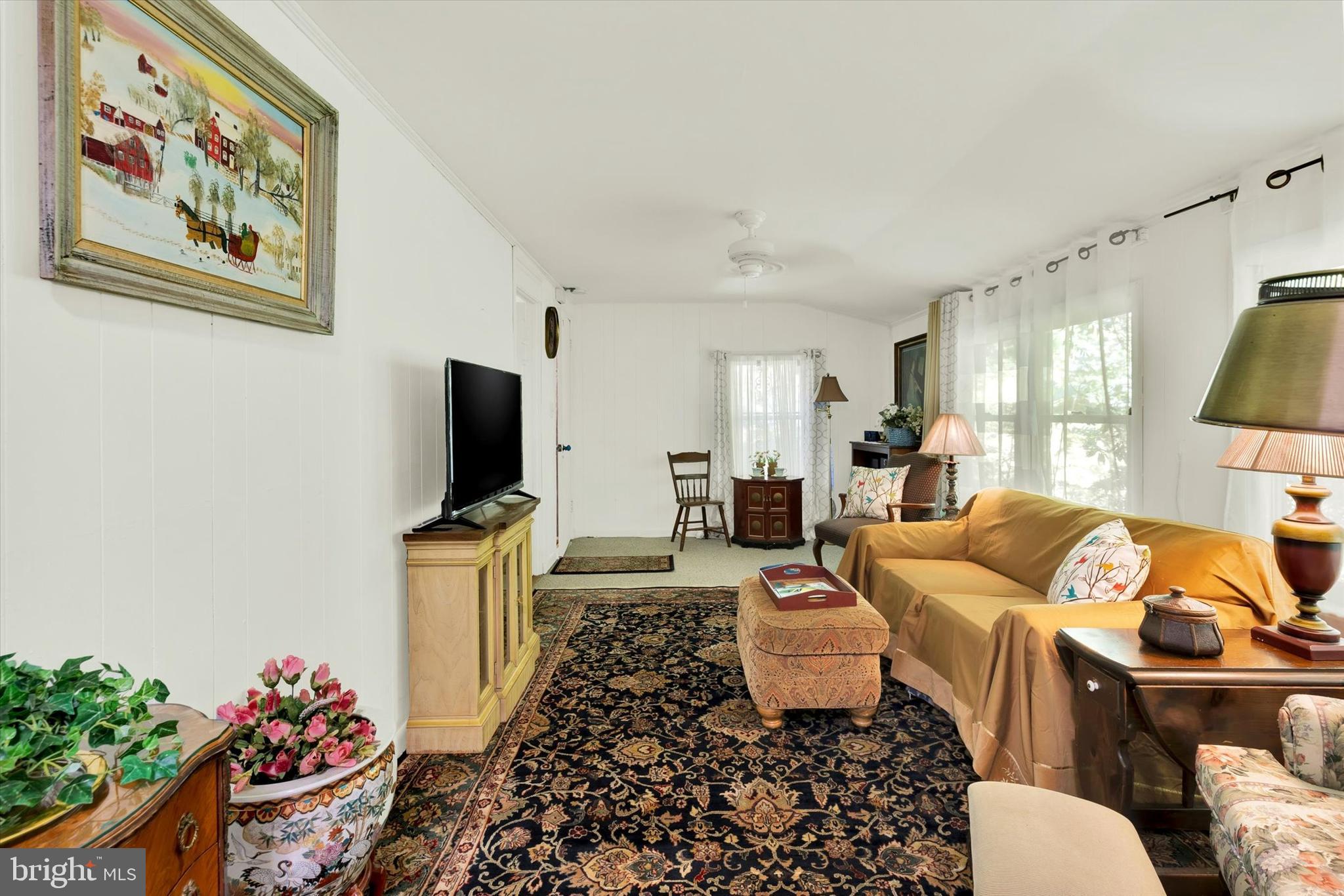 606 Freeland Road Freeland, MD 21053 - Photo 33 of 50 a living room with furniture a flat screen tv and a dining table