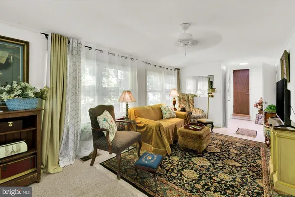 a bed room with a bed window and a dresser
