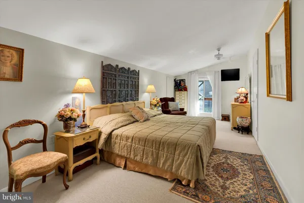 a bedroom with a bed and dresser