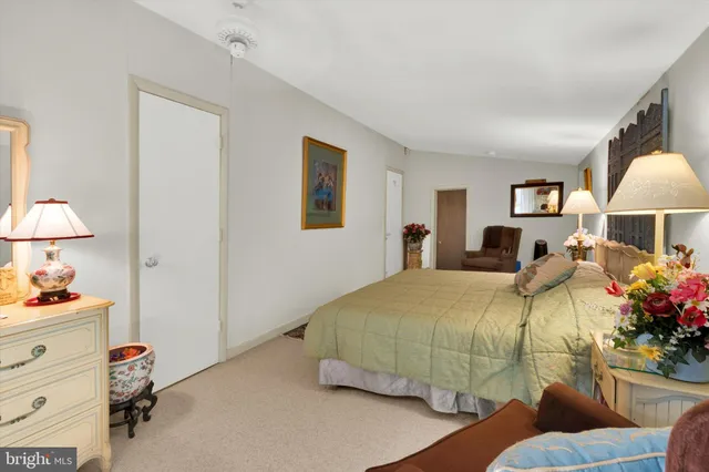 a bedroom with bed and window