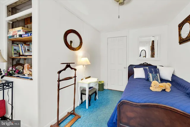 a bathroom with a sink mirror and vanity