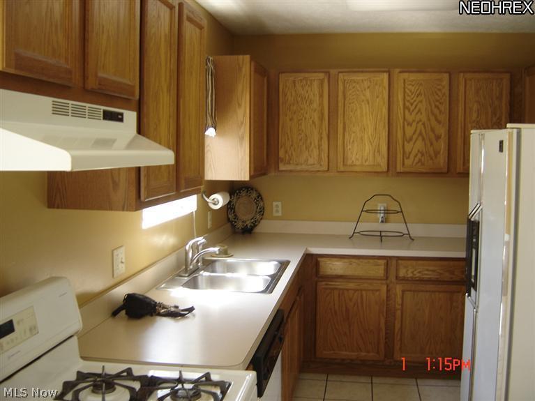 Large kitchen opens into family room appliances stay.
