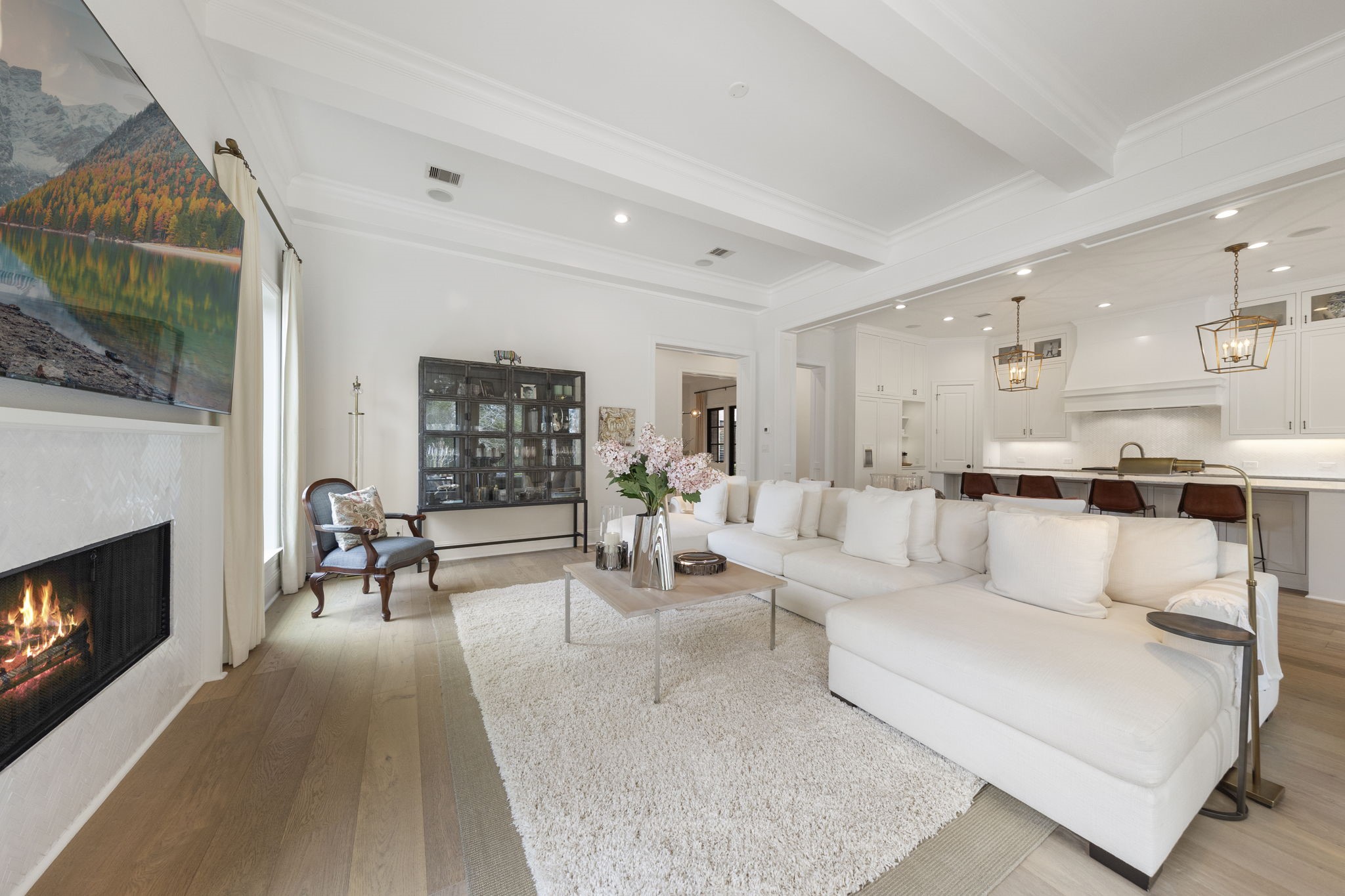 70 Lake Reverie Place Tomball, TX 77375 - Photo 12 of 33 a living room with furniture a fireplace and a flat screen tv