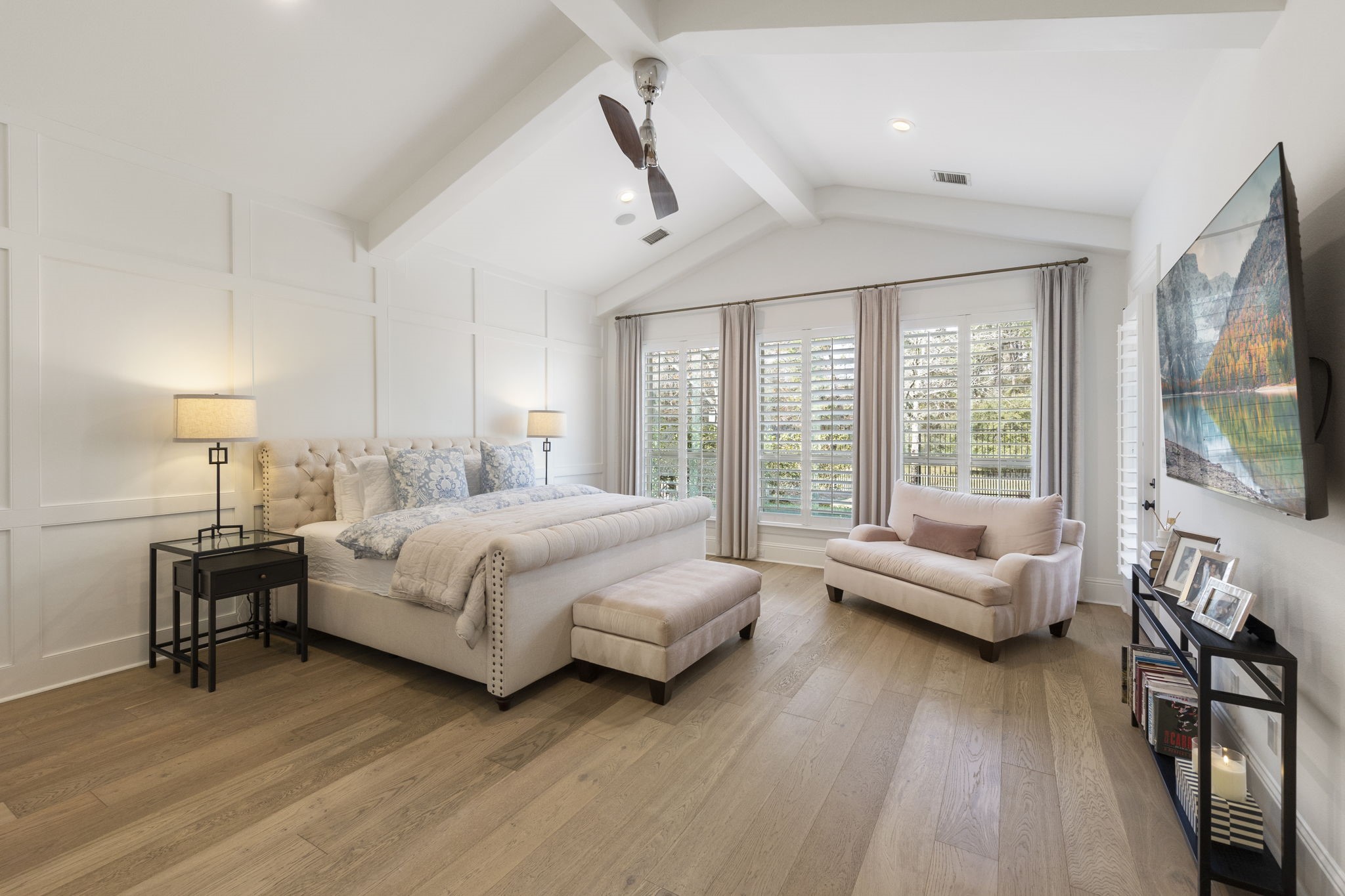 70 Lake Reverie Place Tomball, TX 77375 - Photo 16 of 33 a bedroom with a bed and large windows