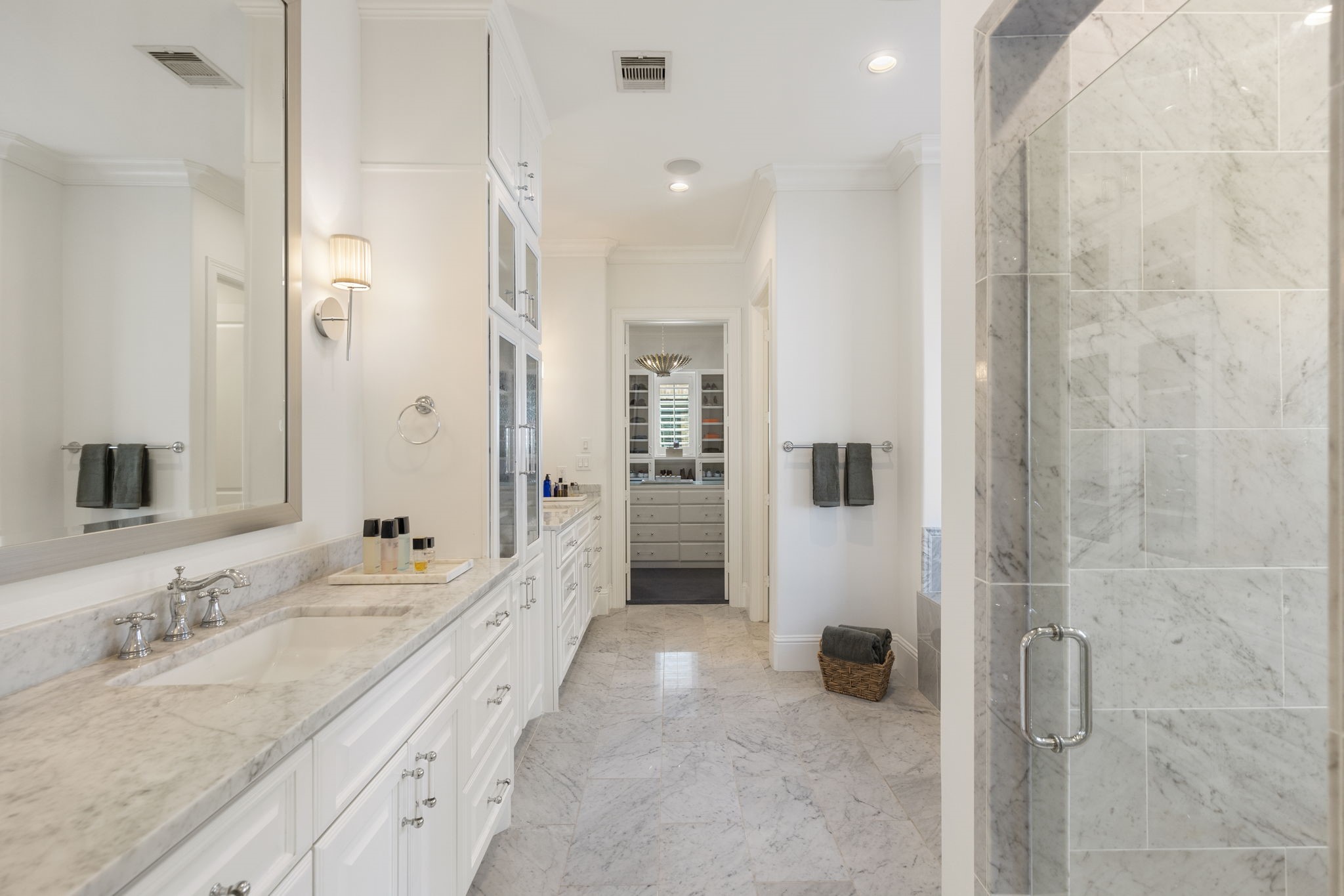 70 Lake Reverie Place Tomball, TX 77375 - Photo 17 of 33 a spacious bathroom with a granite countertop sink a mirror and shower