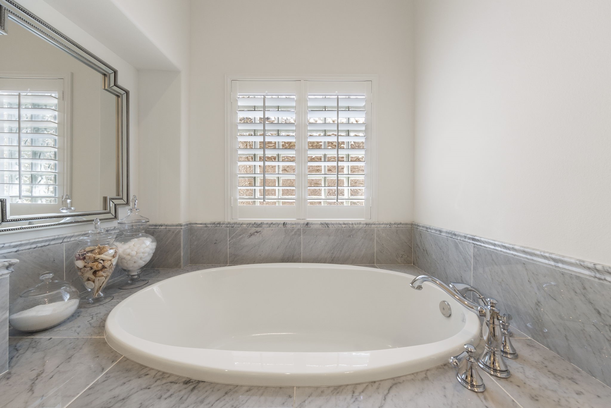 70 Lake Reverie Place Tomball, TX 77375 - Photo 18 of 33 a white bath tub sitting in a bathroom next to a window