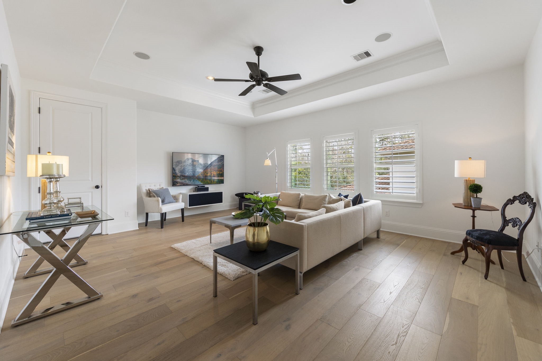 70 Lake Reverie Place Tomball, TX 77375 - Photo 19 of 33 a living room with furniture and a wooden floor