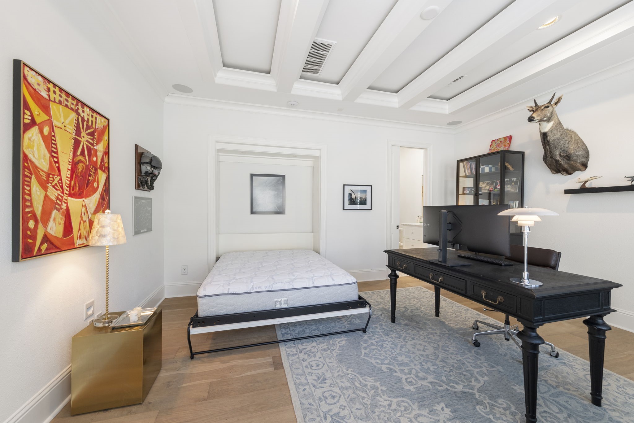 70 Lake Reverie Place Tomball, TX 77375 - Photo 22 of 33 a bedroom with furniture and a wooden floor