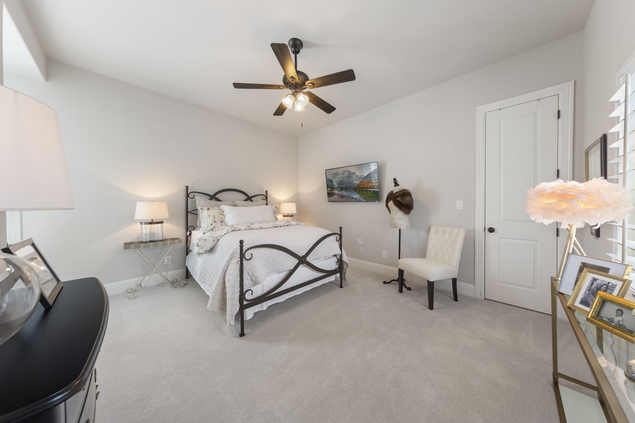 70 Lake Reverie Place Tomball, TX 77375 - Photo 24 of 33 a living room with furniture and a chandelier