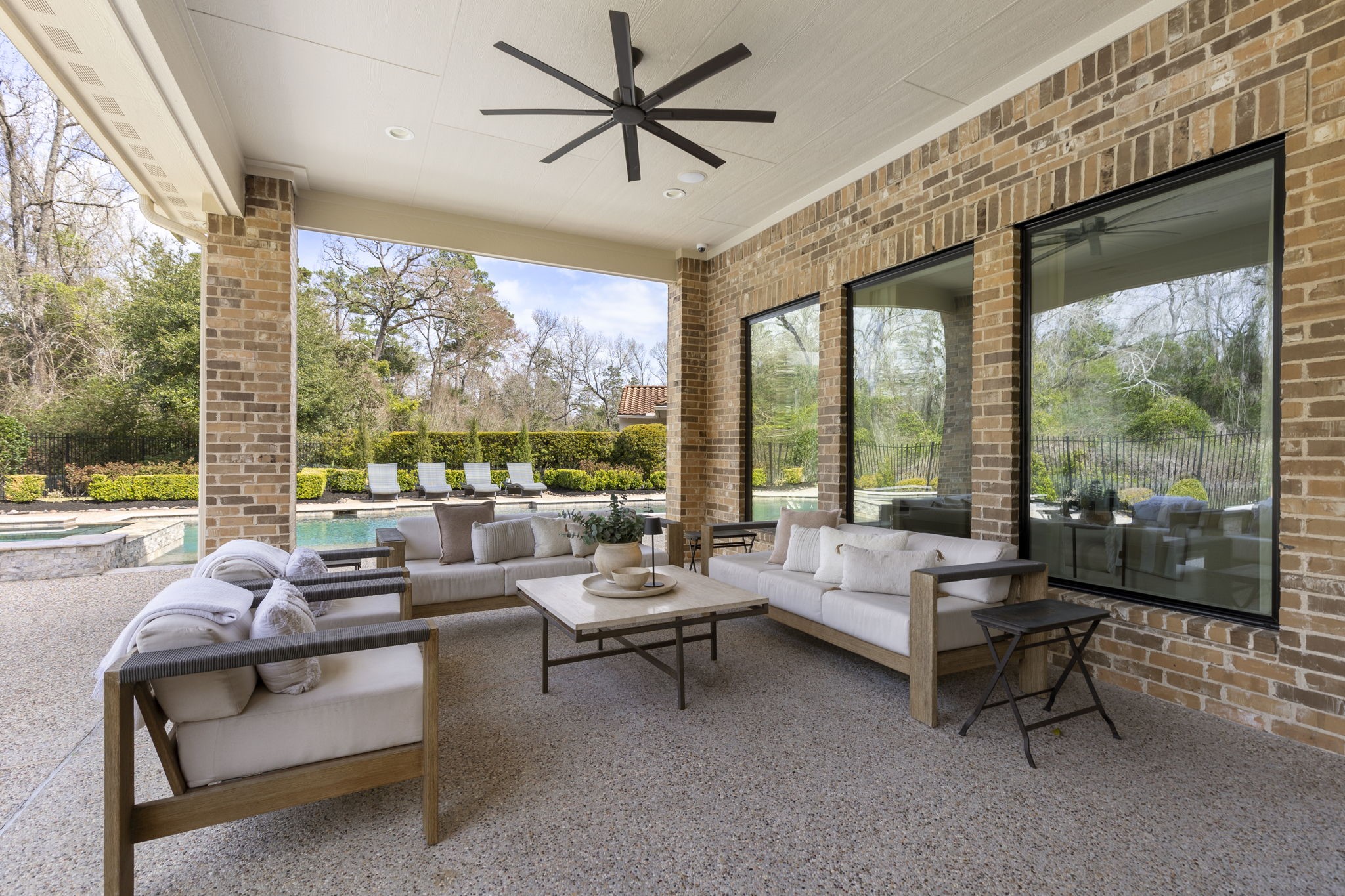 70 Lake Reverie Place Tomball, TX 77375 - Photo 28 of 33 a living room with furniture and a floor to ceiling window