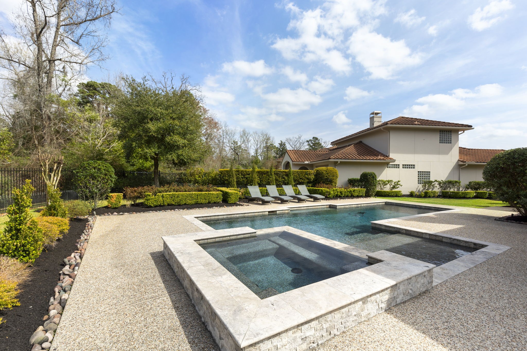 70 Lake Reverie Place Tomball, TX 77375 - Photo 32 of 33 a view of a patio with swimming pool table and chairs