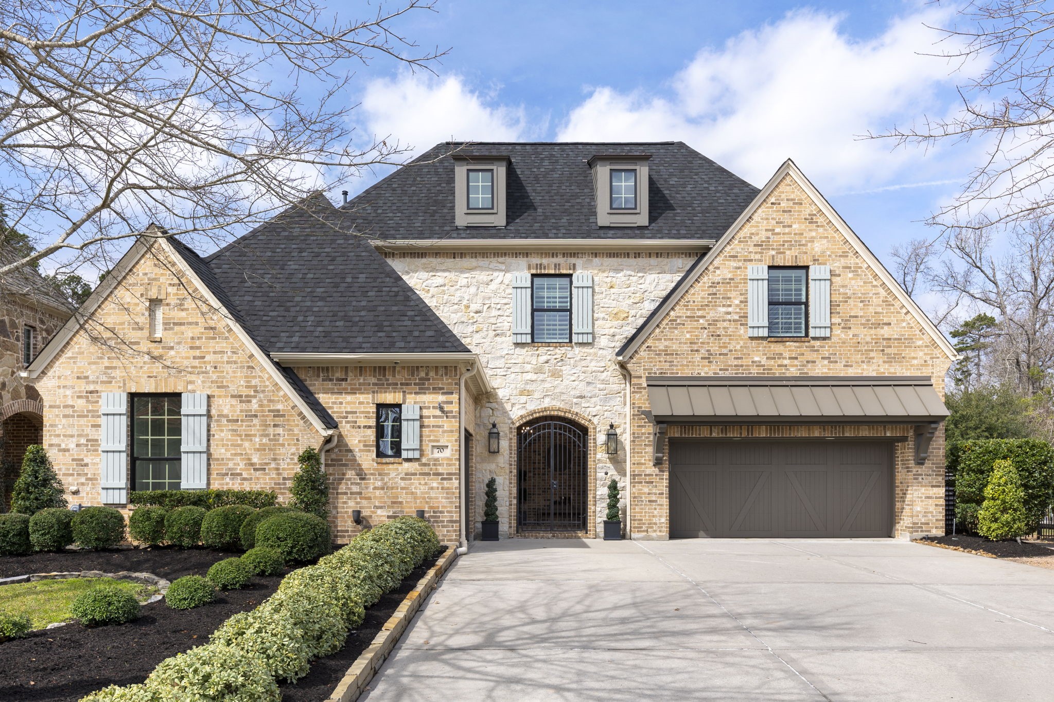 70 Lake Reverie Place Tomball, TX 77375 - Photo 5 of 33 a front view of a house with a garden