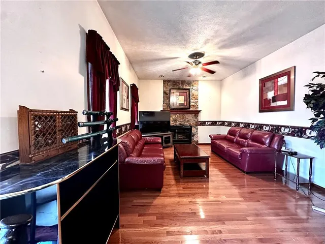 a living room with furniture bathtub and a chandelier