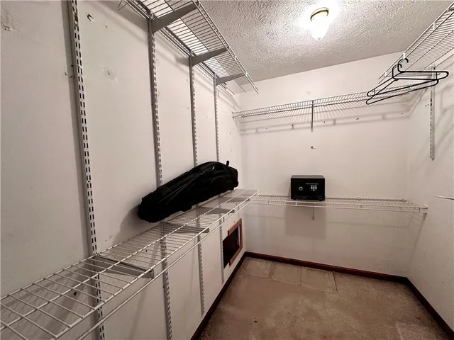 a kitchen with a cabinets and white appliances