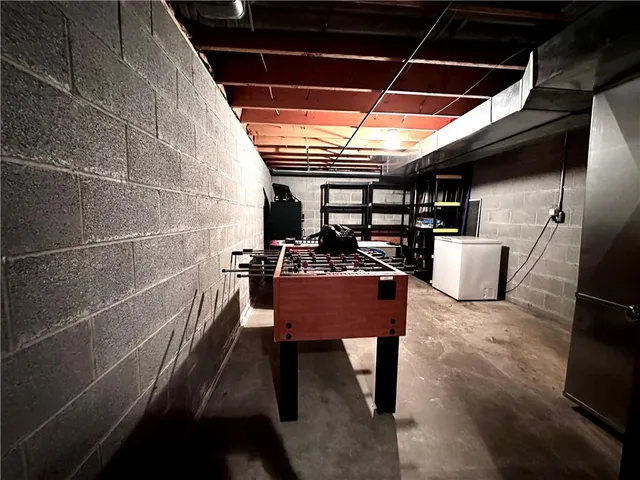 a room with table chair and wooden floor